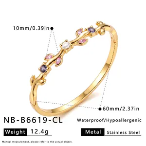 Close-up detail of a gold-plated stainless steel branch bracelet with colorful zircons