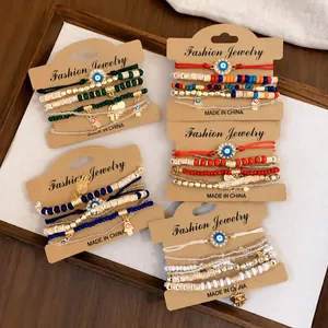 Bohemian evil eye beaded elastic bracelet set with hamsa charms on display cards