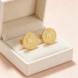 Macro detail of vintage gold embossed Virgo zodiac coin earrings in jewelry box