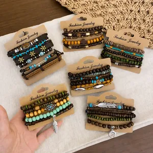 Handcrafted multilayer bohemian beaded bracelet set with feather charms on display cards