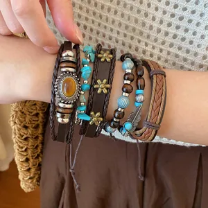 Detailed view of Bohemian multi-layer beaded and braided leather bracelet set on wrist