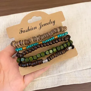 Detail view of bohemian style beaded bracelet set with natural wooden and green beads