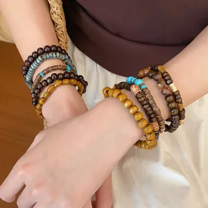 Stacked bohemian beaded bracelet set featuring natural wood and turquoise accents