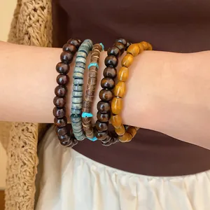 Detailed view of bohemian style beaded bracelet set featuring wood and turquoise accents.