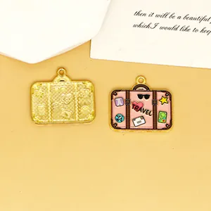 Detailed macro view of heart pattern enamel suitcase pendants for DIY jewelry making crafts