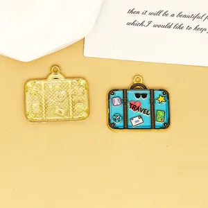 Detailed macro view of colorful enamel suitcase charm with 'Travel' text and icons