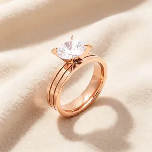 Detailed view of elegant rose gold titanium steel ring with a large four-prong zircon