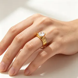 Close-up of a gold-plated stainless steel ring featuring a large round brilliant zircon