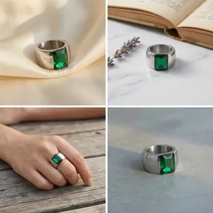 Detailed quad-grid view of titanium steel ring with a large rectangular emerald green stone