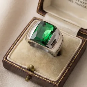 Elegant emerald green rectangular glass stone ring set in wide silver titanium band