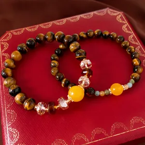Elegant tiger's eye stone beaded bracelet with yellow and clear crystal beads on red box