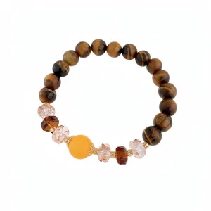 Elegant Tiger Eye stone beaded bracelet with faceted crystals and center yellow bead accent