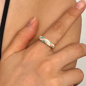 Handcrafted colorful enamel ring with pink and blue floral pattern on gold band