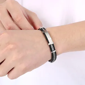 Bracelet homme en cuir tressé avec fils d'acier et plaque métallique incurvée