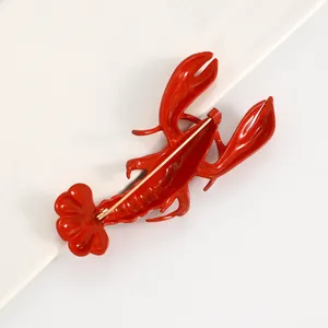 Detailed back view of a vibrant red lobster brooch showing the secure gold-tone pin