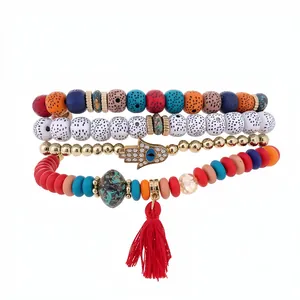 Bohemian 4-piece elastic beaded bracelet set with Hamsa hand and red tassel charms