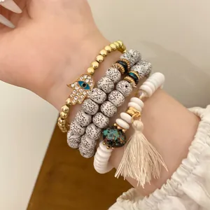 Bohemian ethnic style Hamsa Hand and Evil Eye beaded elastic bracelet set with tassel detail