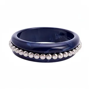 Elegant navy marbled resin bangle featuring a row of silver-tone crystal-studded circles