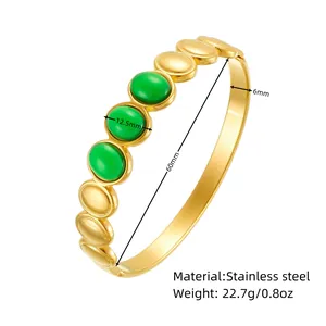 Detail view of bohemian stainless steel bangle with green oval stones and measurements