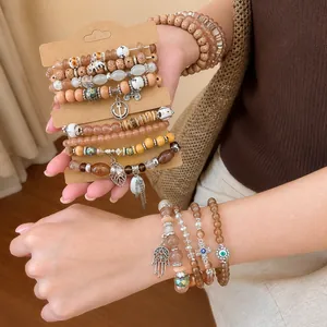 Bohemian multi-layer acrylic beaded bracelet set featuring hamsa and evil eye charms