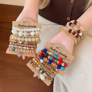 Bohemian multi-layer acrylic bead bracelet set with assorted charms and rhinestones