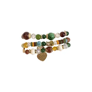 Bohemian multi-layer beaded bracelet set featuring colorful acrylic stones and heart charm
