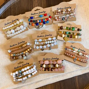 High-resolution detail view of nine sets of Bohemian style beaded bracelets on cards