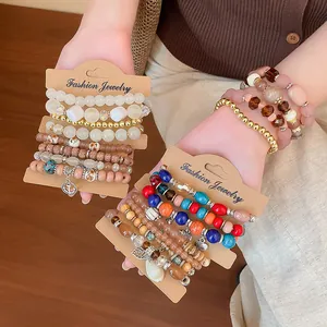 Detailed view of stylish bohemian acrylic bracelet sets with colorful beads and charms.