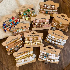 Detailed view of bohemian beaded bracelet sets featuring charms and acrylic accents