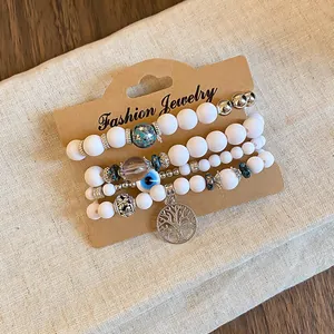Bohemian white acrylic bead bracelet set with Tree of Life and Evil Eye charms