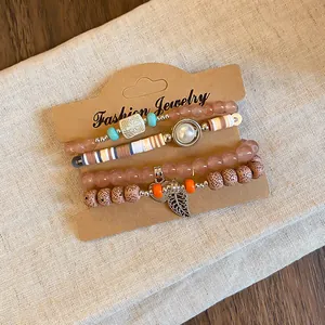 Close-up of Bohemian acrylic beaded bracelet set with heart and leaf charms