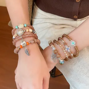 Bohemian multi-layer acrylic bead bracelet set with Evil Eye and Hamsa hand charms