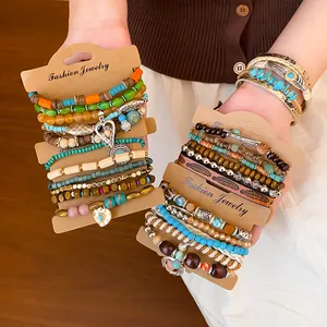 Detailed view of bohemian multilayer beaded and leather bracelet sets on display cards