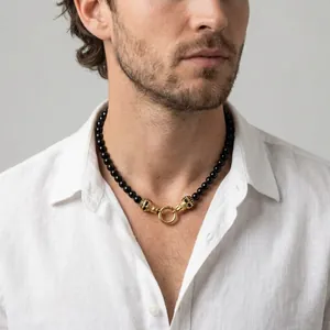 Punk vintage men's necklace featuring black onyx beads and golden skull head charms