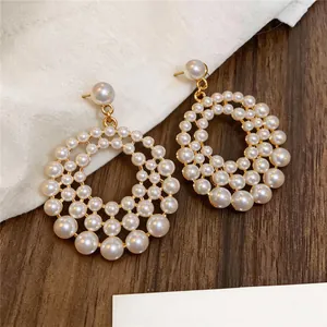 Elegant French style hollow round pearl dangle earrings with gold metal frame details