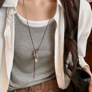 Korean style minimalist leather cord necklace with silver fish pendant detail