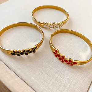 Vintage gold enamel flower bangle bracelets for women with elegant floral design