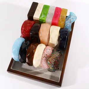 Detailed collection of vintage wide resin bangles in various marbled colors and textures