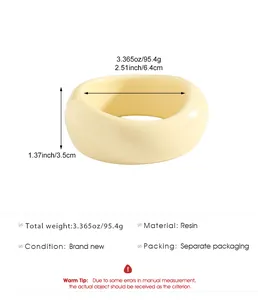 Detailed view of the vintage cream resin wide bangle showing measurements and material specifications