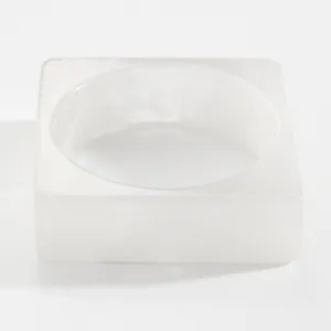 Close-up of white marbled resin wide square bangle for women