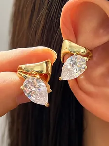Elegant gold twisted ear cuff with a large pear-cut cubic zirconia, no piercing