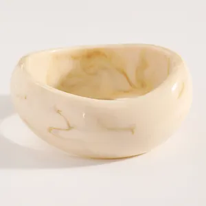 Close-up view of the vintage marble pattern on this wide resin bangle bracelet detail