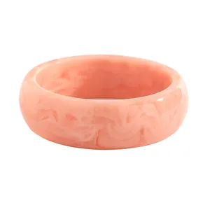 Detailed view of vintage marbled peach resin bangle showing unique swirl patterns