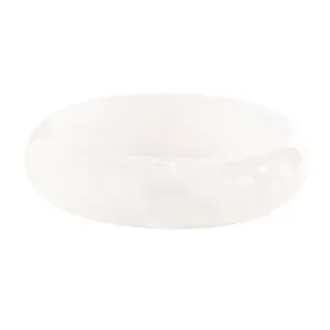 Detail of a vintage-style wide white resin bangle with translucent texture