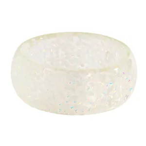 Detailed close-up view of a wide translucent resin bangle with iridescent flakes.