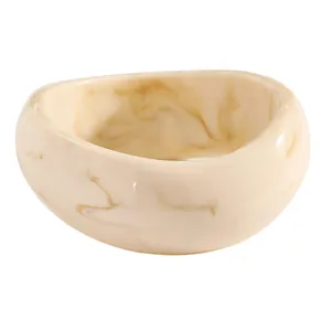 Detailed view of wide retro resin bangle with light brown marble texture