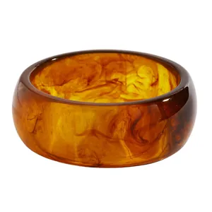 Detailed view of the marbled texture on this vintage wide resin bangle bracelet