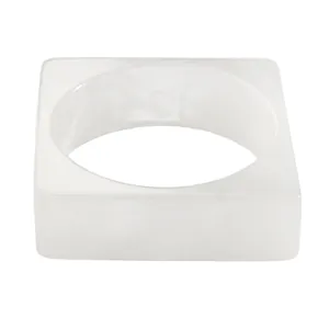 Close-up of retro white resin wide bangle with a smooth translucent finish and square outer edge