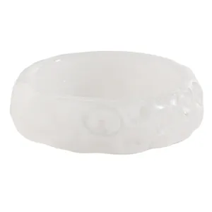 Close-up of white textured resin bangle showing unique lunar crater pattern surface