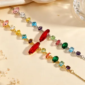 Elegant detail of two colorful gemstone necklaces with gold and silver-tone chains.
